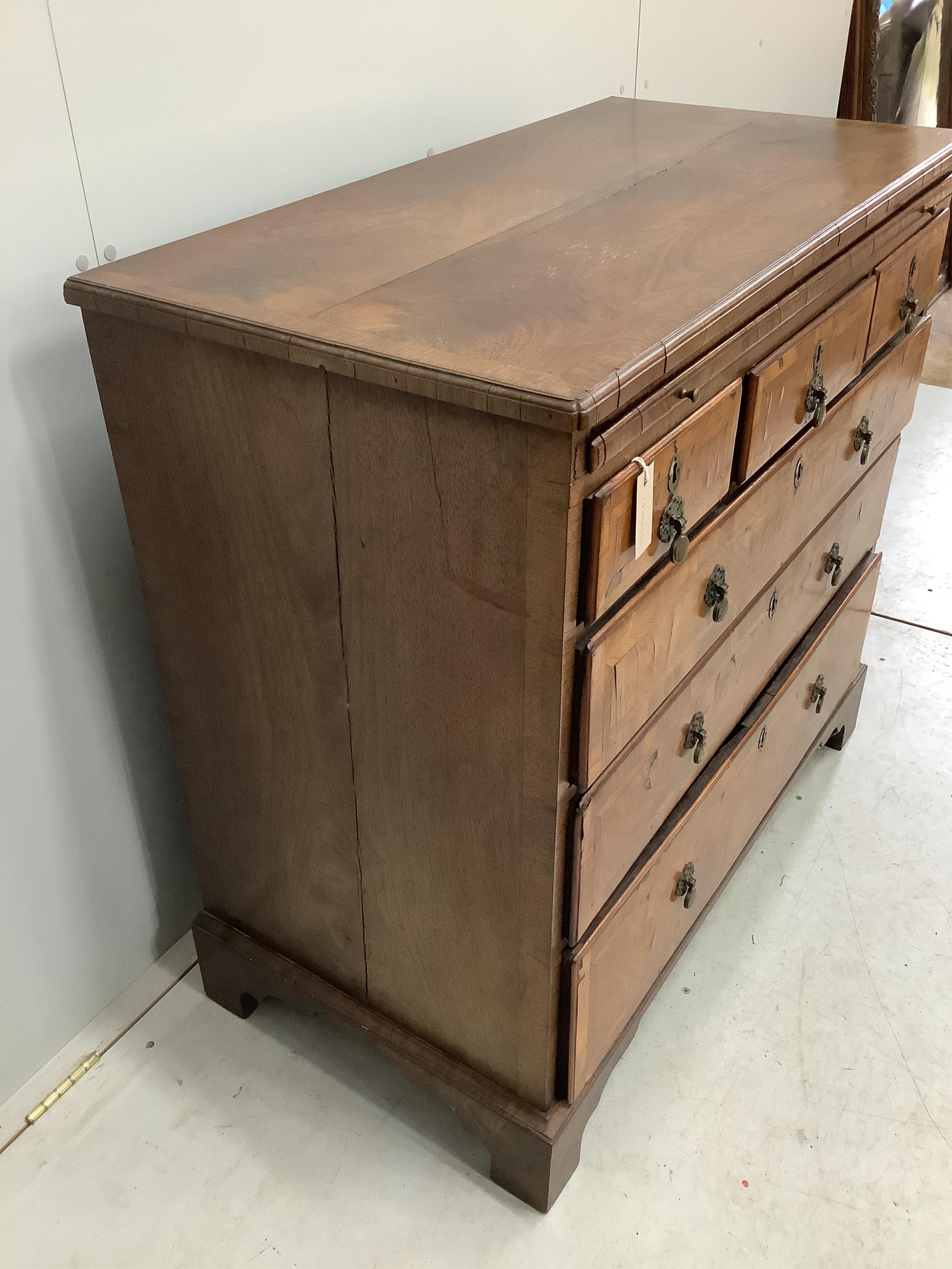 A George II walnut and isometric banded chest of drawers, width 99cm, depth 51cm, height 94cm. Condition - fair